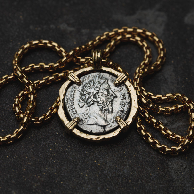 Marcus Aurelius gold and two-tone necklace on charcoal stone